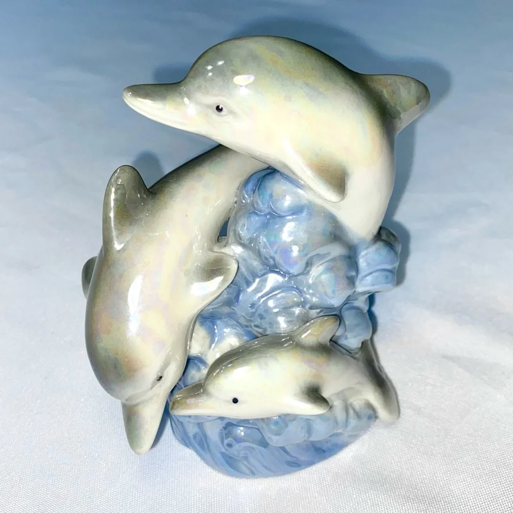 Glazed Ceramic Dolphin Trio on a blue Wave